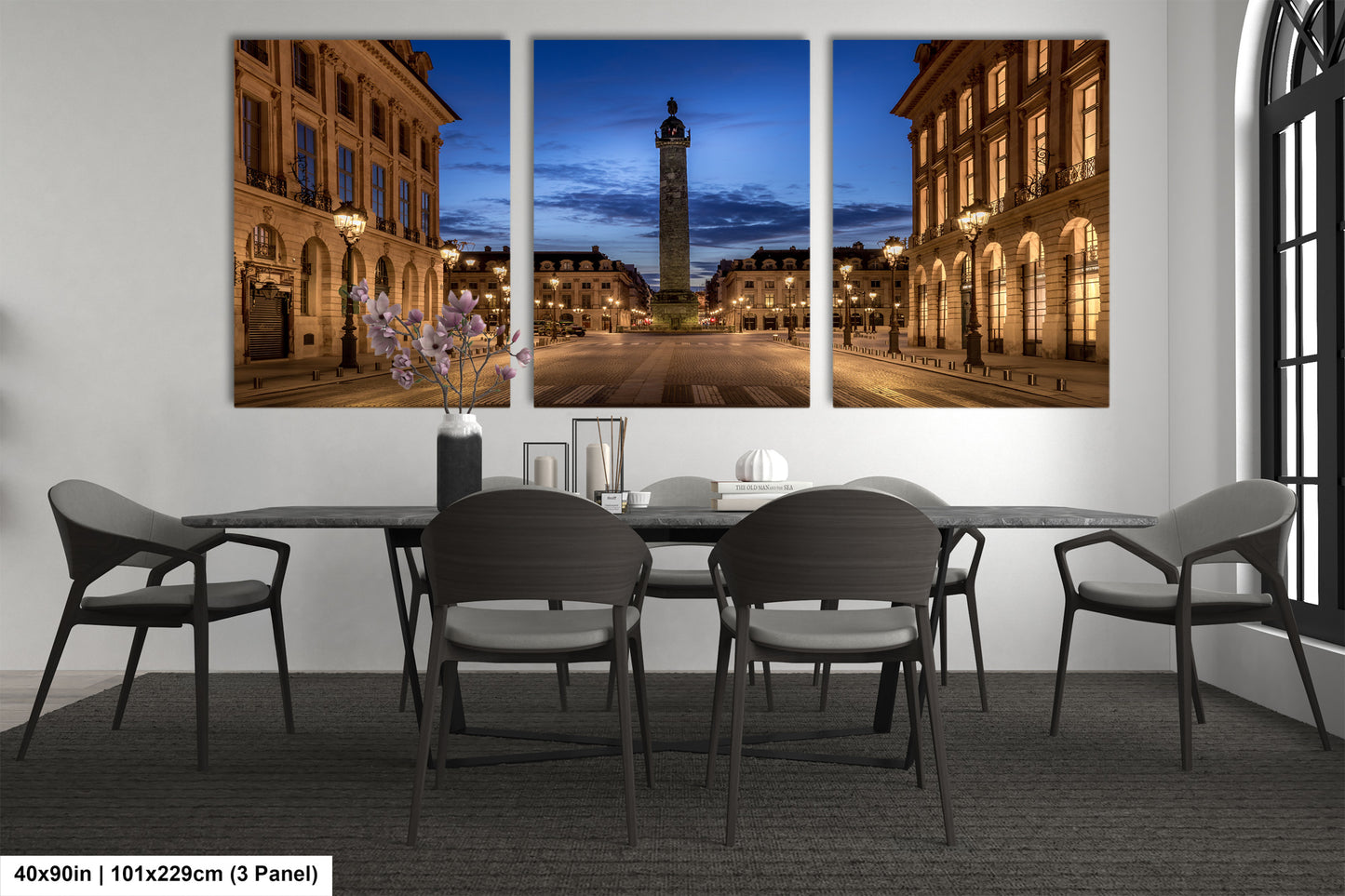 a dining room table with four chairs and a clock tower in the background