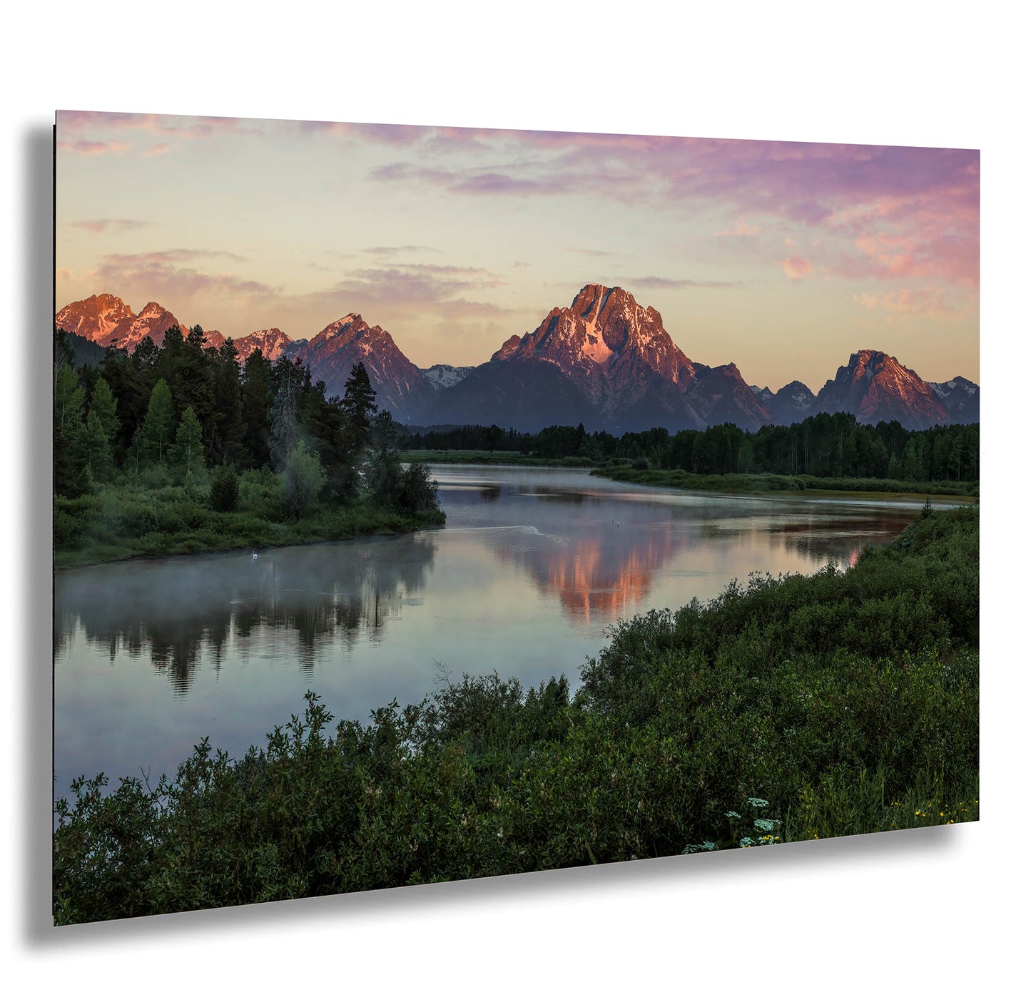 a river with a mountain range in the background