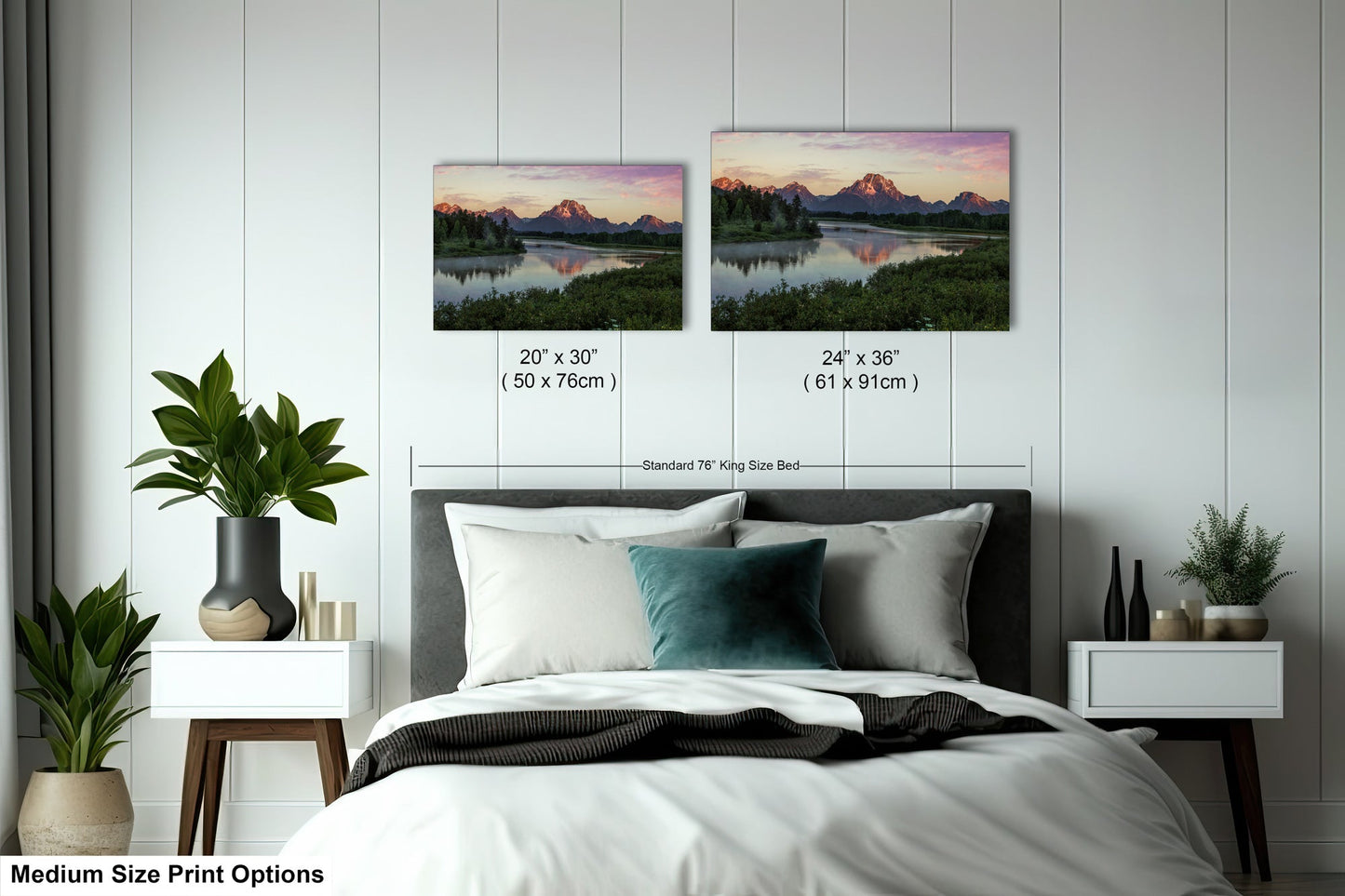 a bed with two pictures on the wall above it