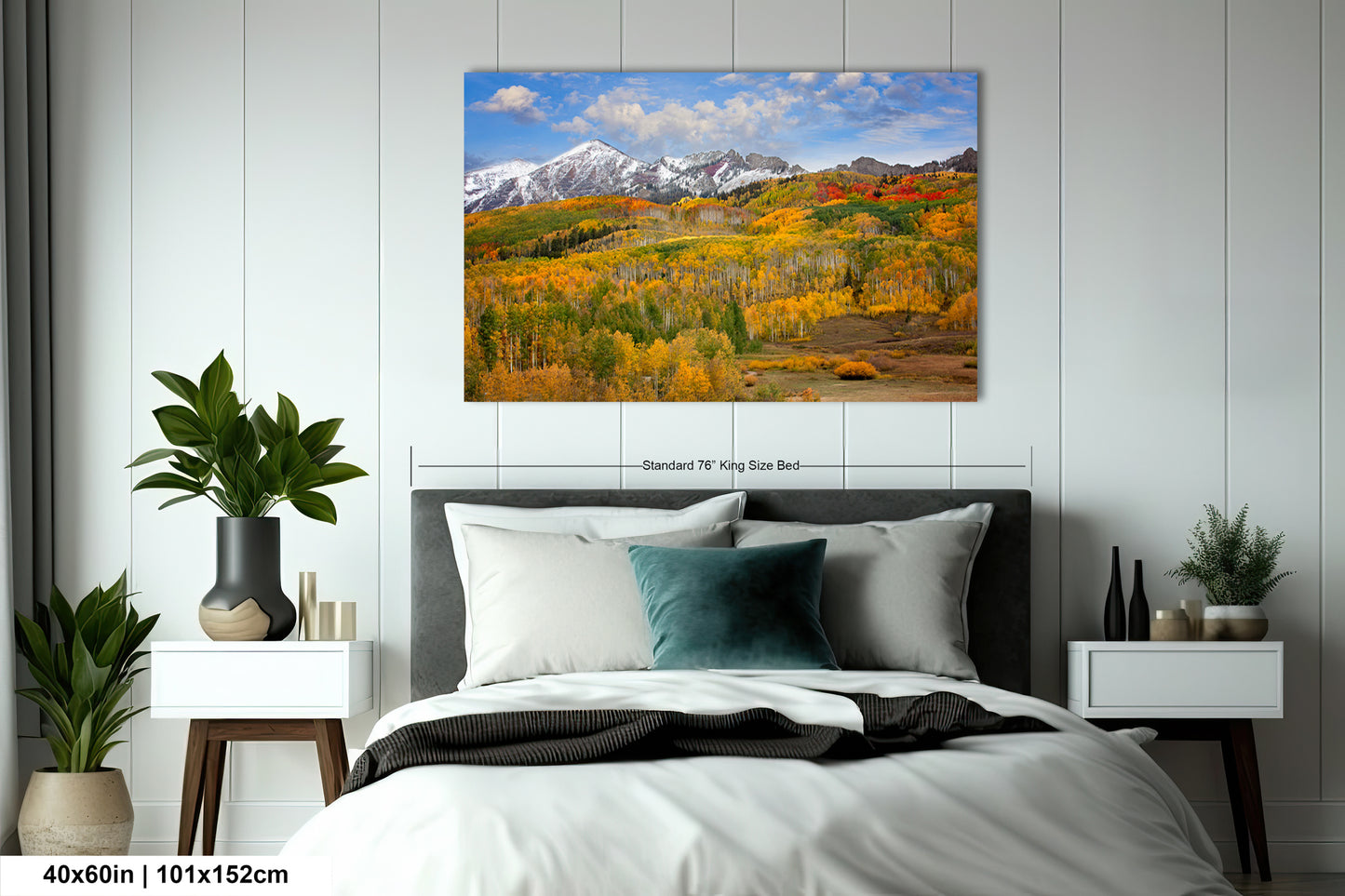 a bed in a room with a painting on the wall