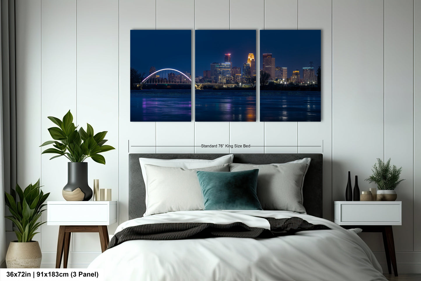 a bedroom with a bed and a night view of a city