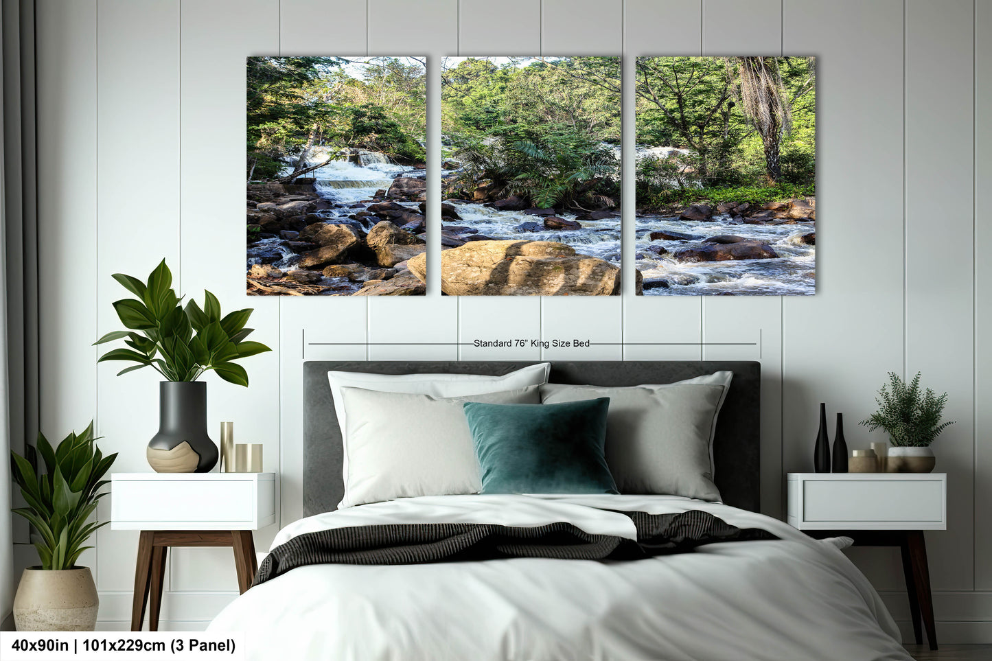a bed room with a neatly made bed and two paintings on the wall