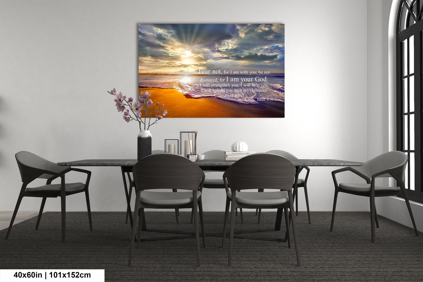 a dining room table with chairs and a painting on the wall