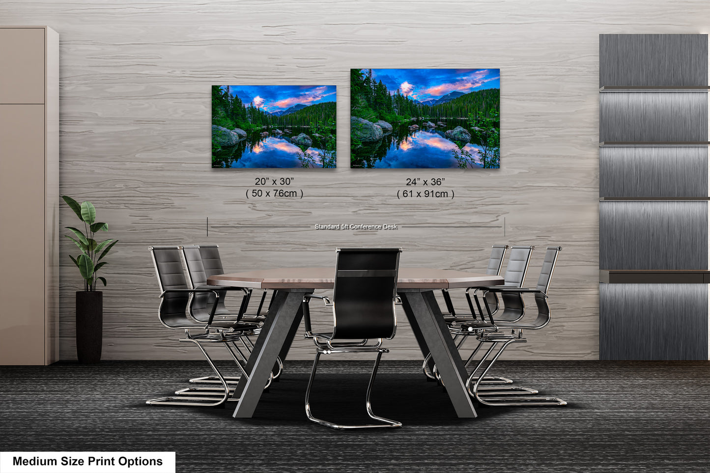 a dining room table with four chairs and two pictures on the wall