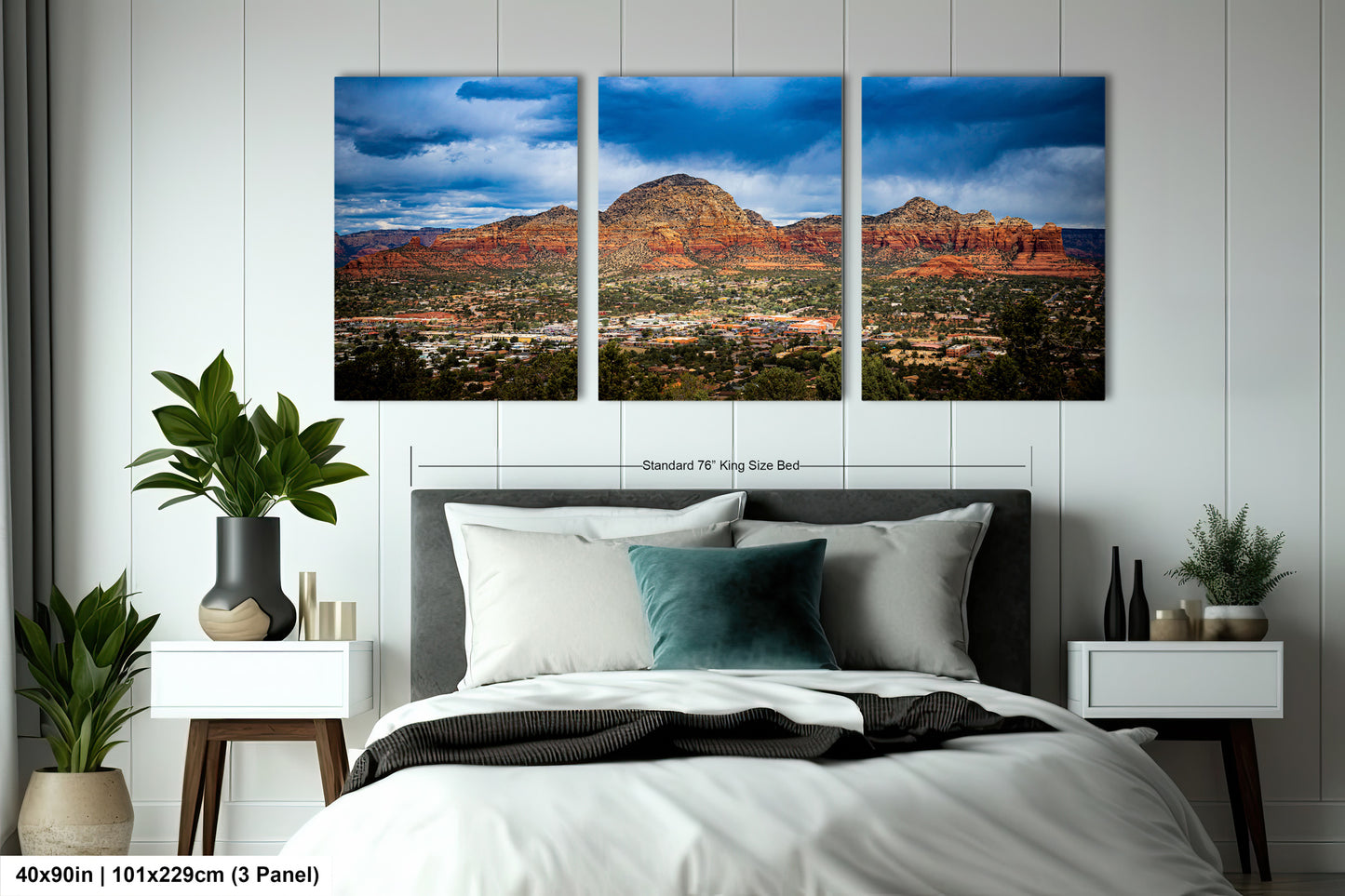 a bed room with a neatly made bed and two pictures on the wall