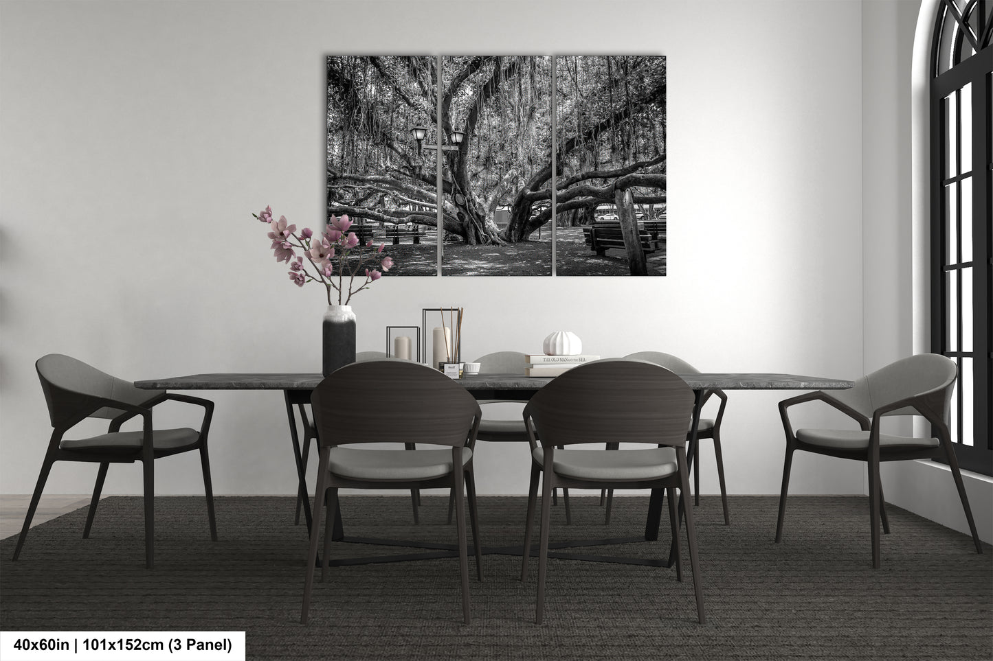 a black and white photo of a dining room table