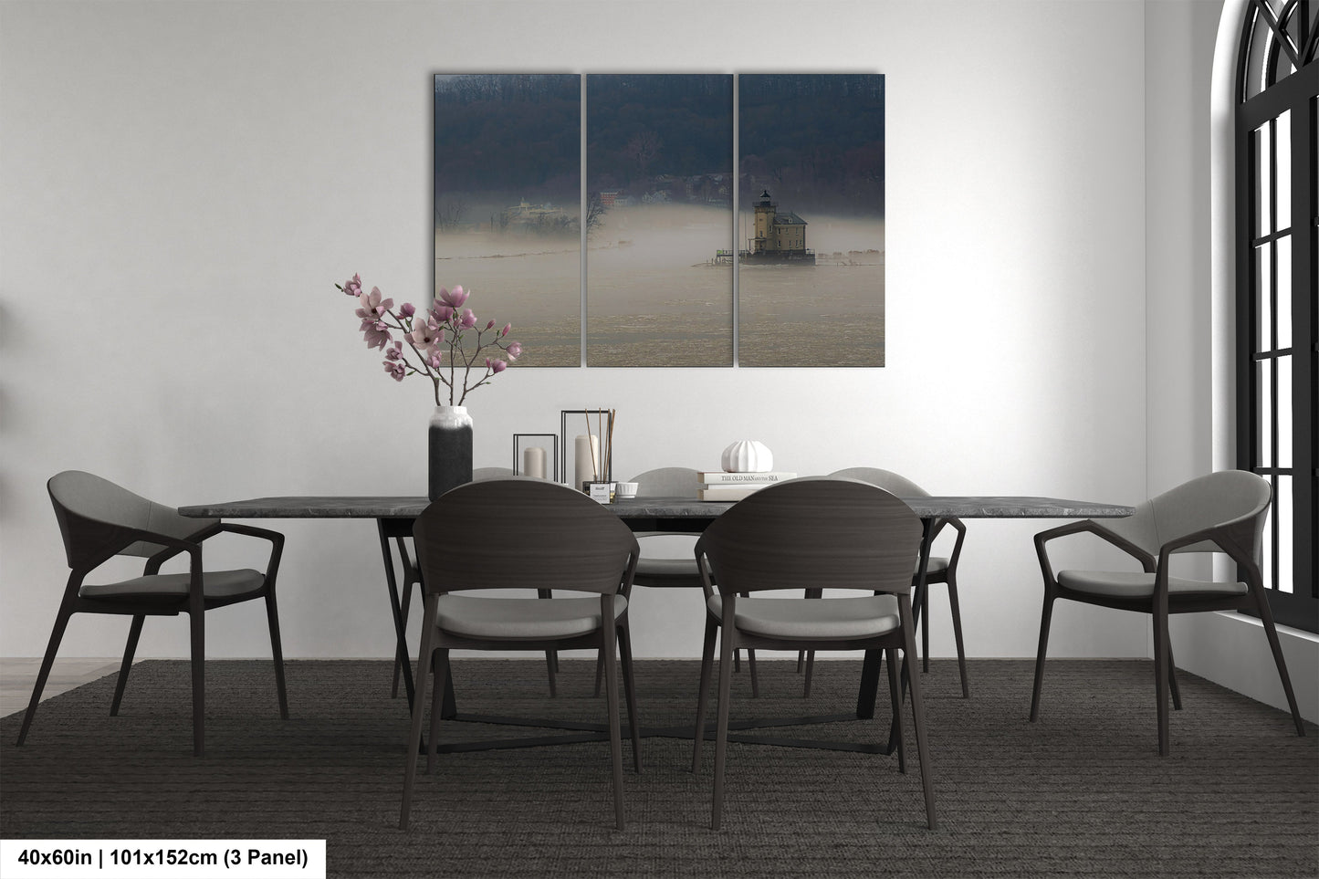 a dining table with four chairs and a vase of flowers
