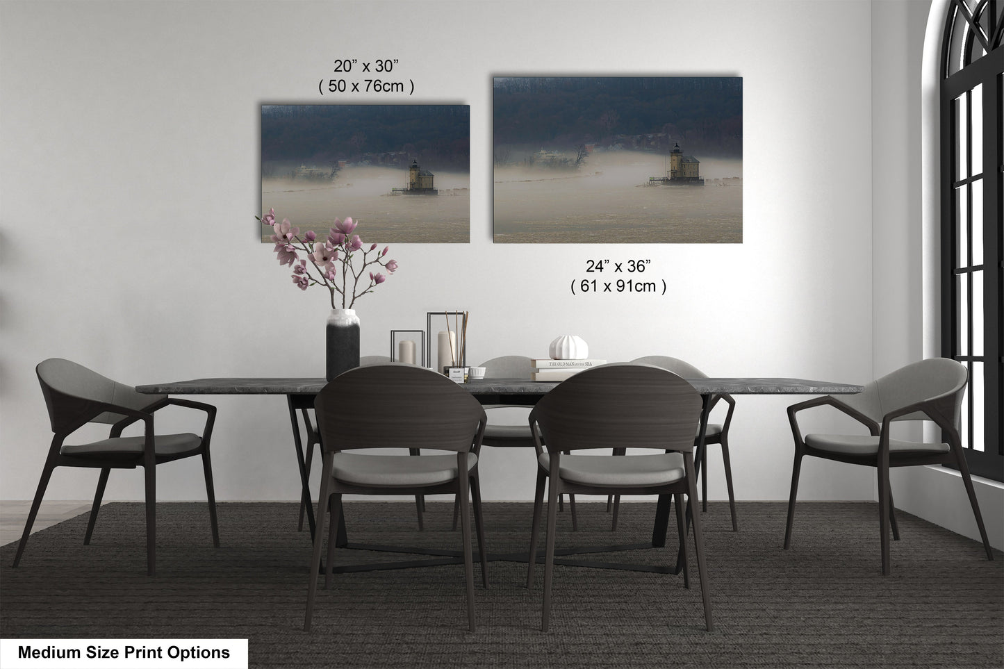 a dining table with four chairs and a vase of flowers
