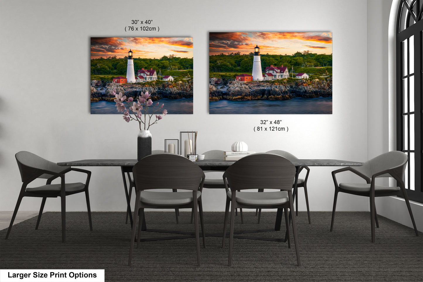 a dining room table with four chairs and a painting of a lighthouse