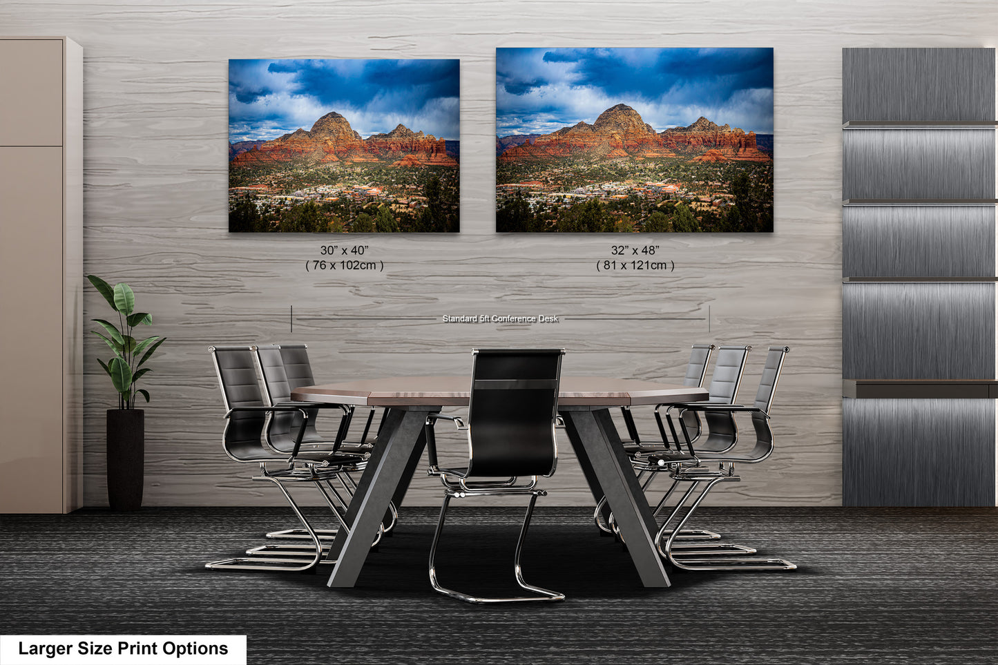a dining room table with chairs in front of two pictures of mountains