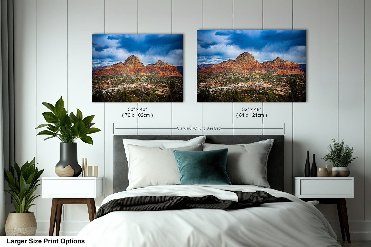 a bedroom with a bed and two pictures on the wall