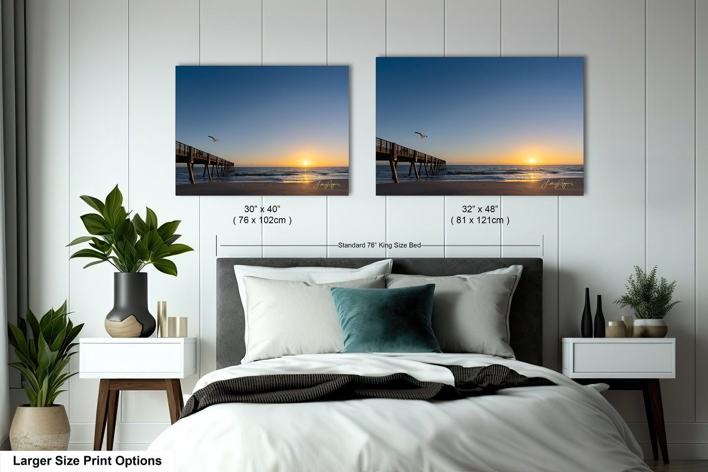 a bedroom with a bed and two pictures on the wall