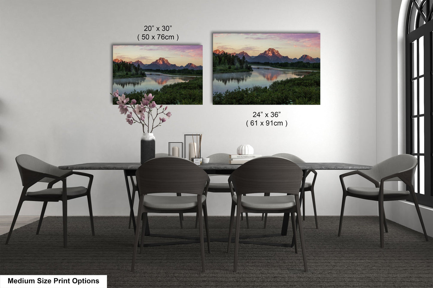 a dining table with four chairs and a vase of flowers
