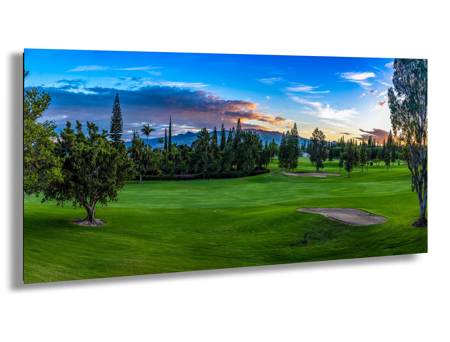 a painting of a golf course at sunset