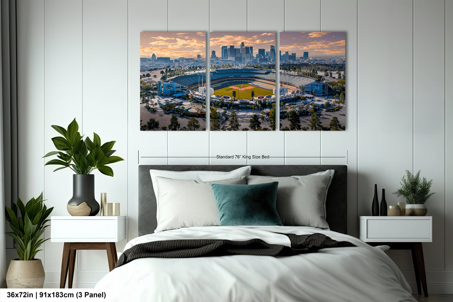 a bedroom with a large bed and two paintings on the wall
