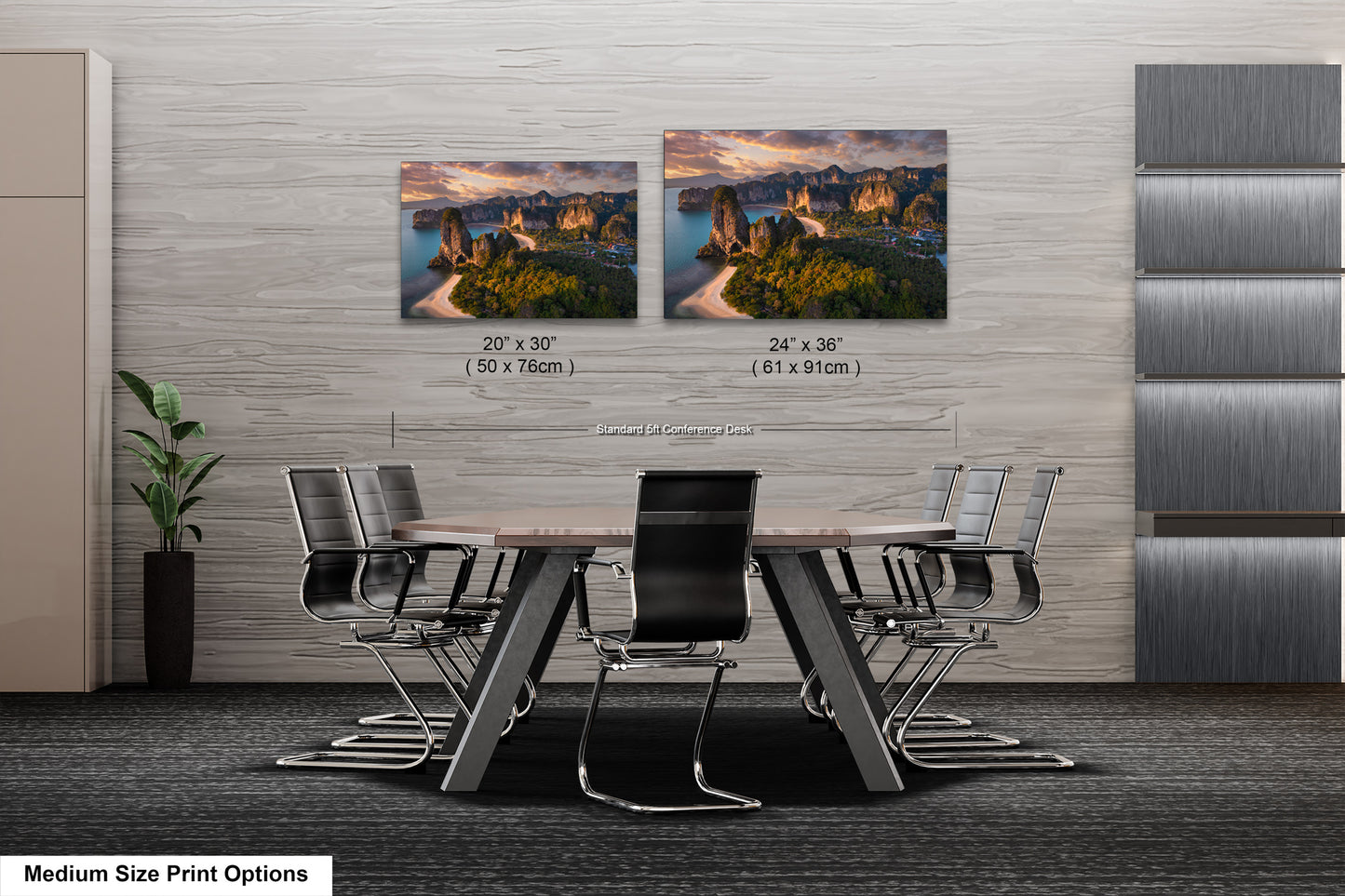a dining room table with four chairs and two pictures on the wall