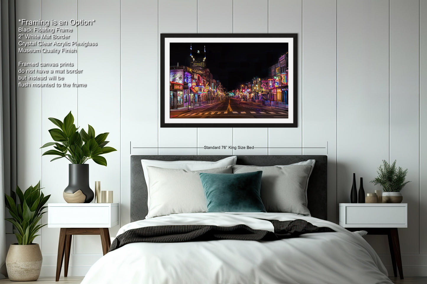 a bedroom with a bed and a picture hanging on the wall