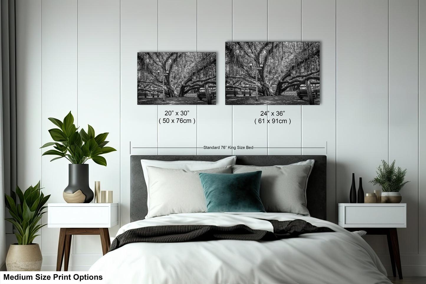 a bed with a white comforter and two black and white pictures on the wall