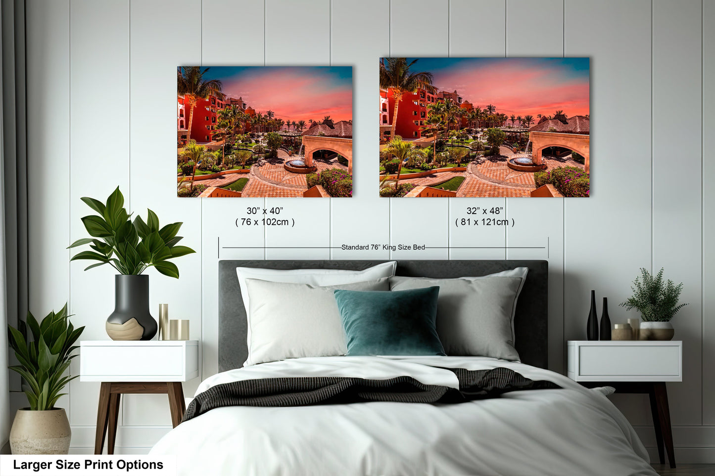 a bedroom with a bed and two pictures on the wall