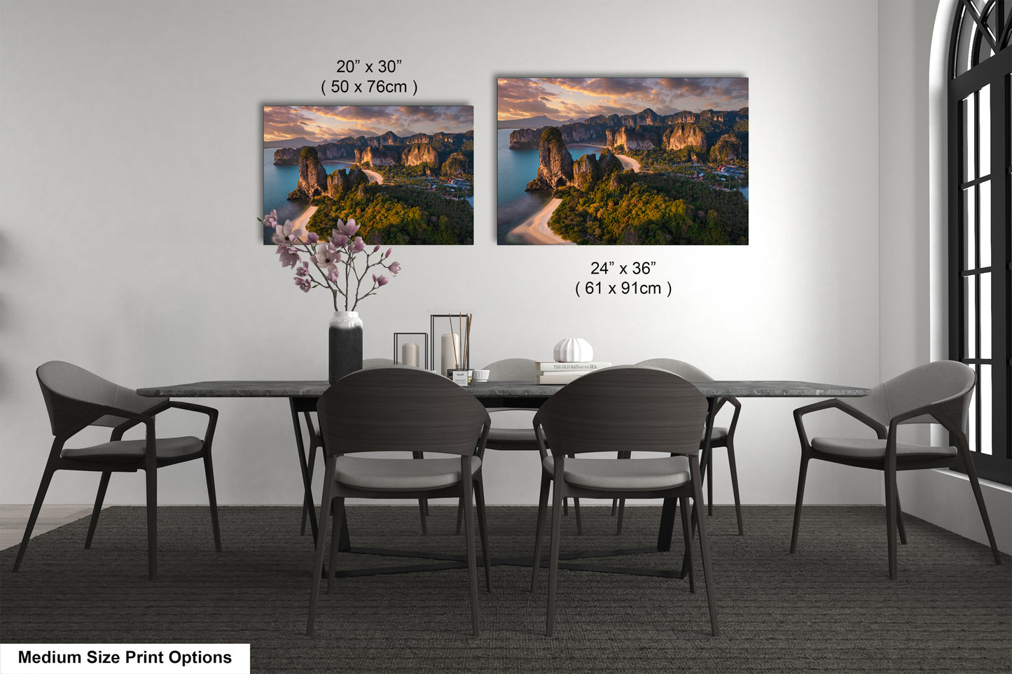 a dining table with four chairs and a vase of flowers