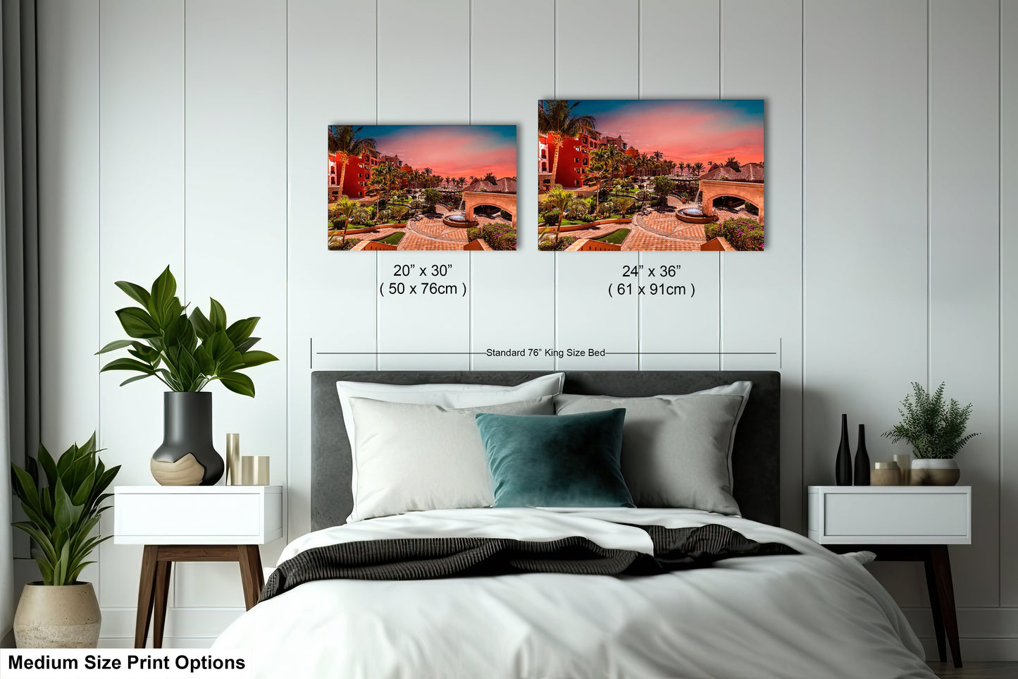 a bed room with a neatly made bed and two pictures on the wall