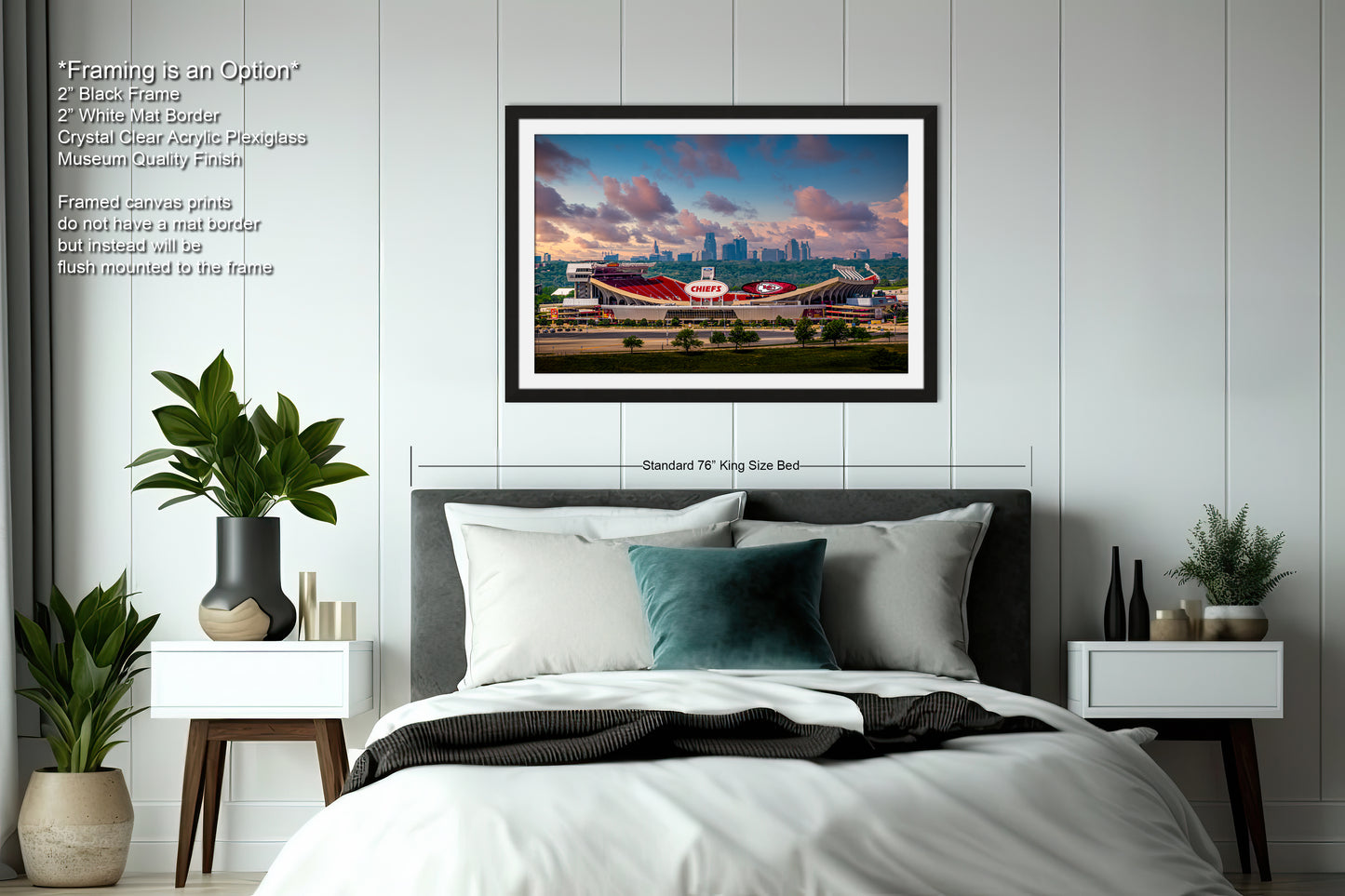 a bedroom with a large bed and a picture hanging above it