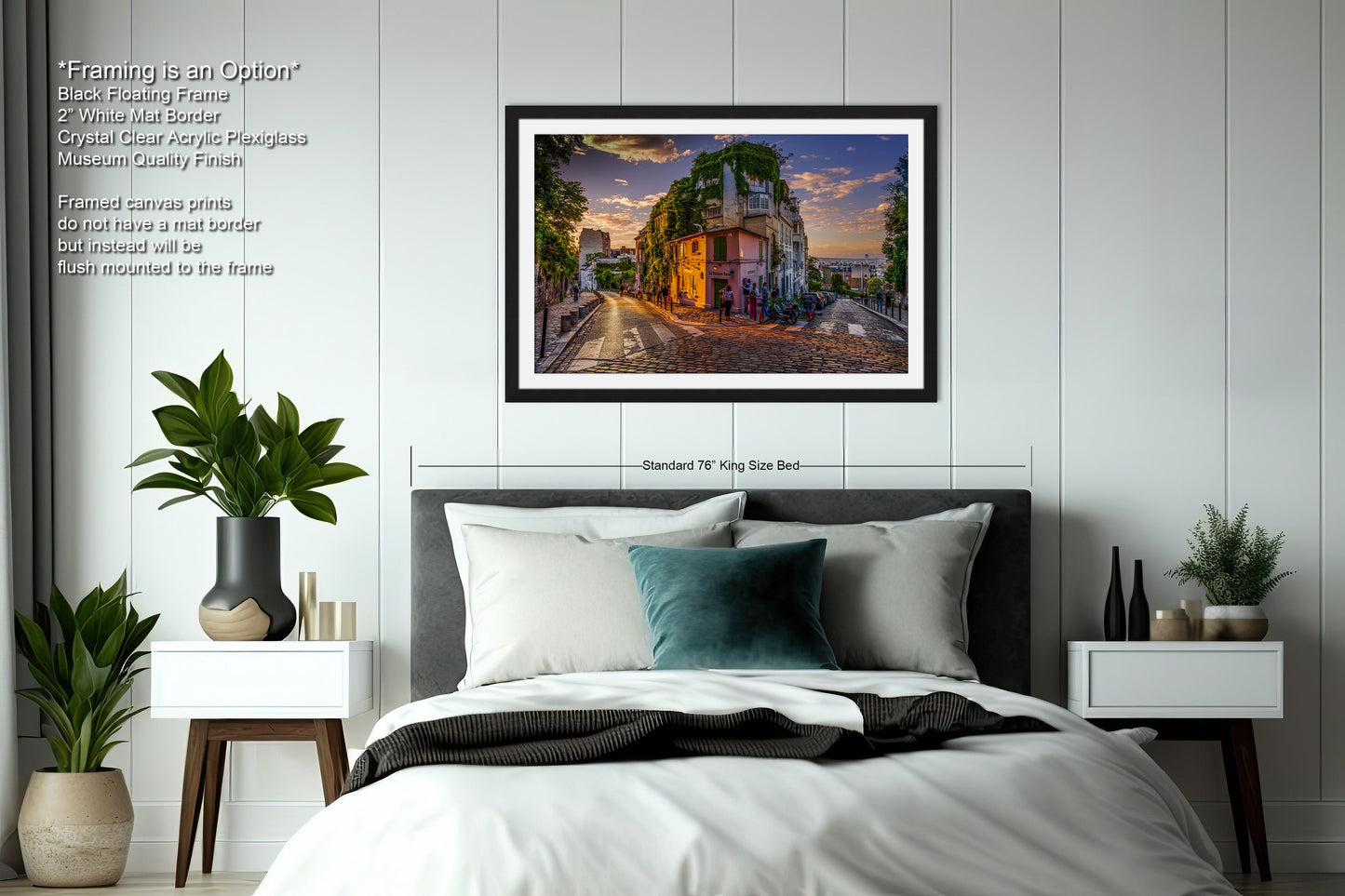 a bedroom with a bed and a picture hanging on the wall