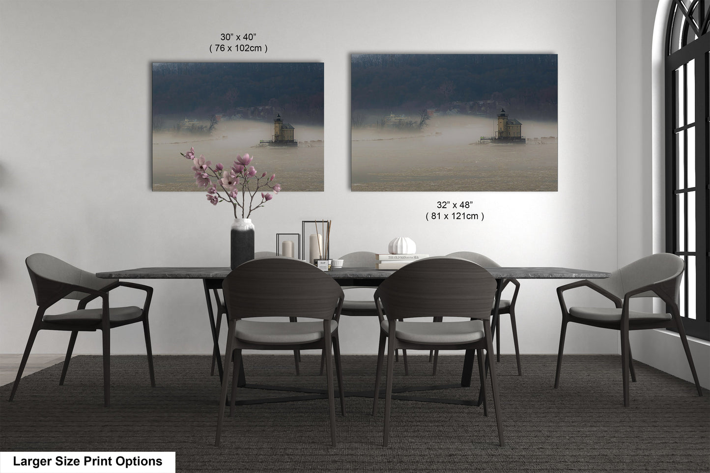 a dining table with four chairs and a vase of flowers