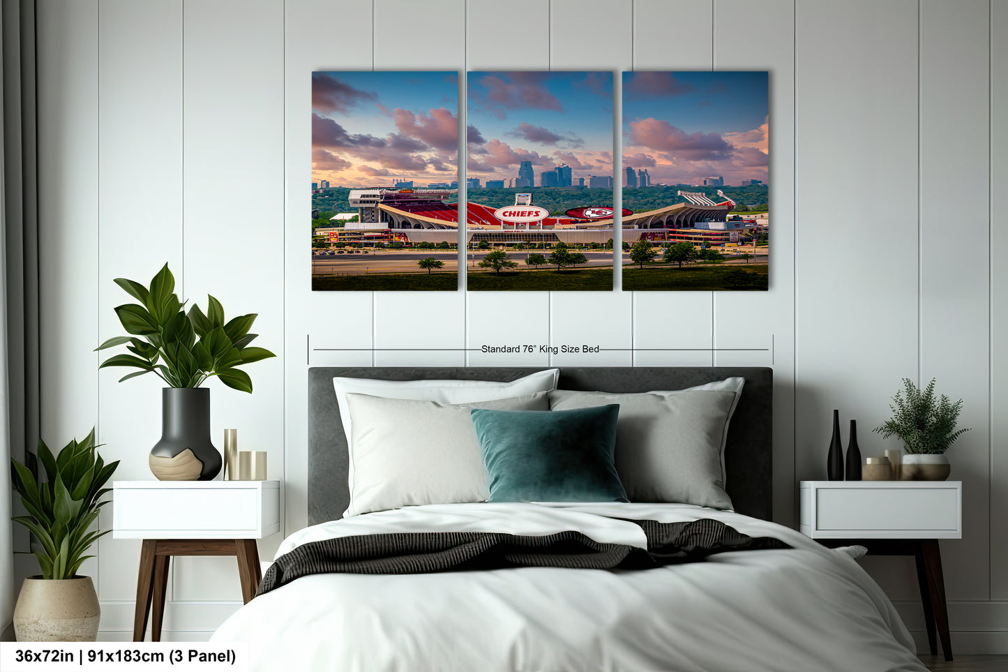 a bedroom with a large bed and three paintings on the wall
