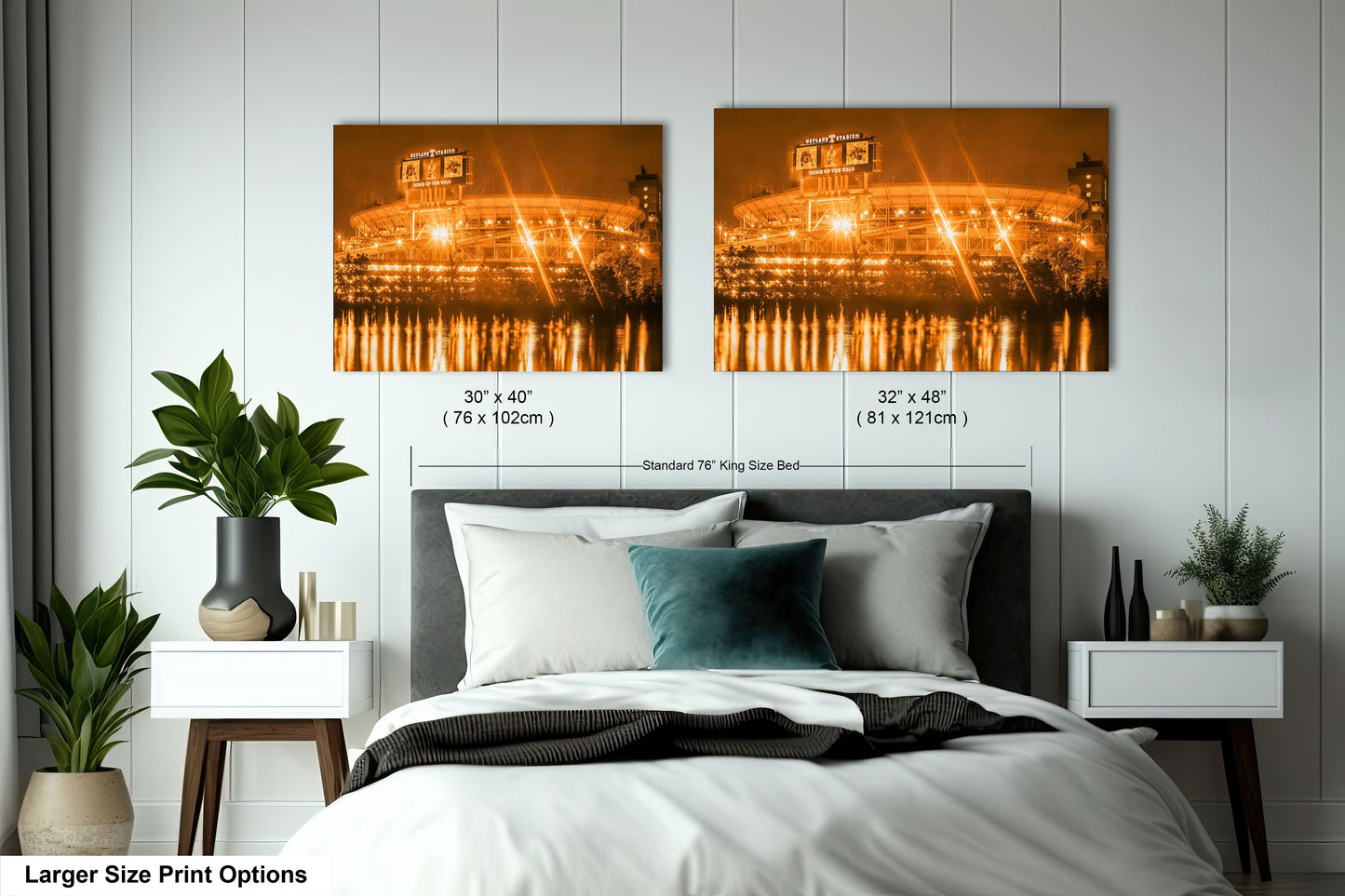 a bedroom with a large bed and two pictures on the wall