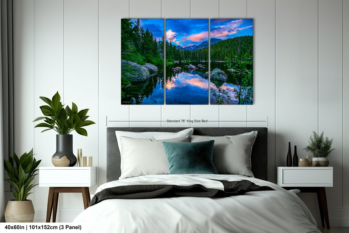 a bedroom with a bed and a painting on the wall