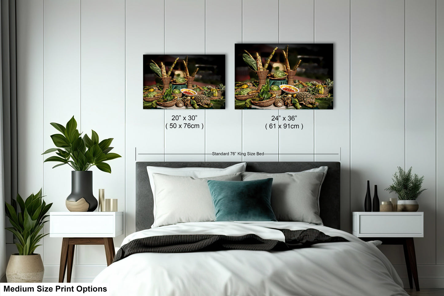 a bed with two pictures on the wall above it