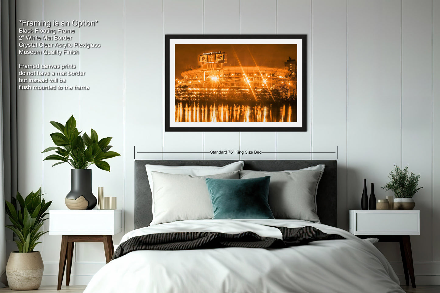 a bedroom with a large bed and a picture on the wall