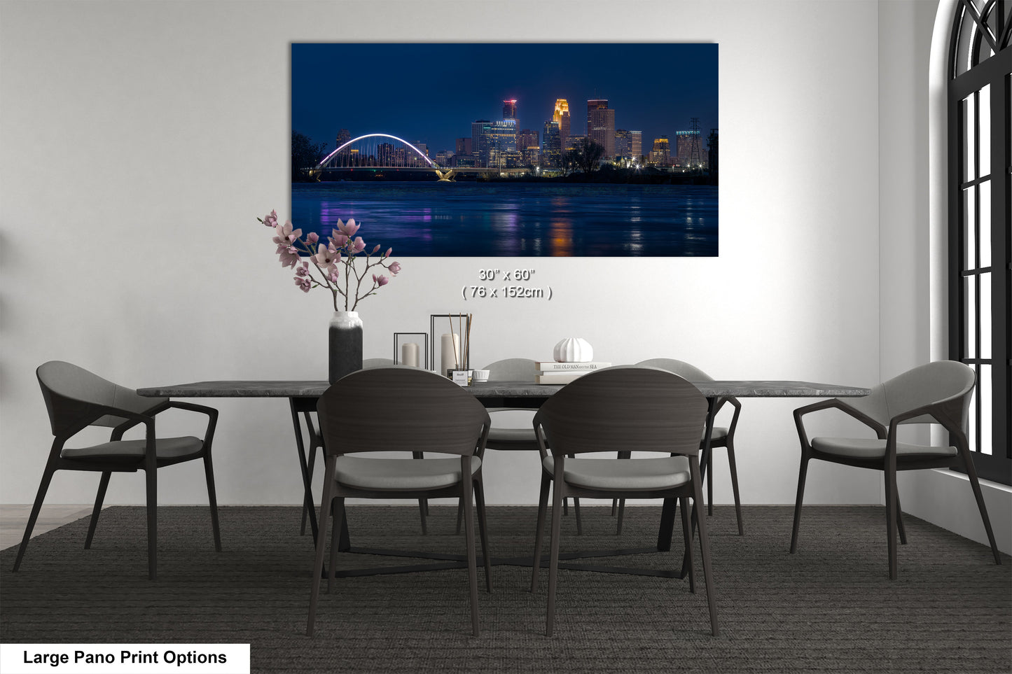a dining room table with a view of a city at night