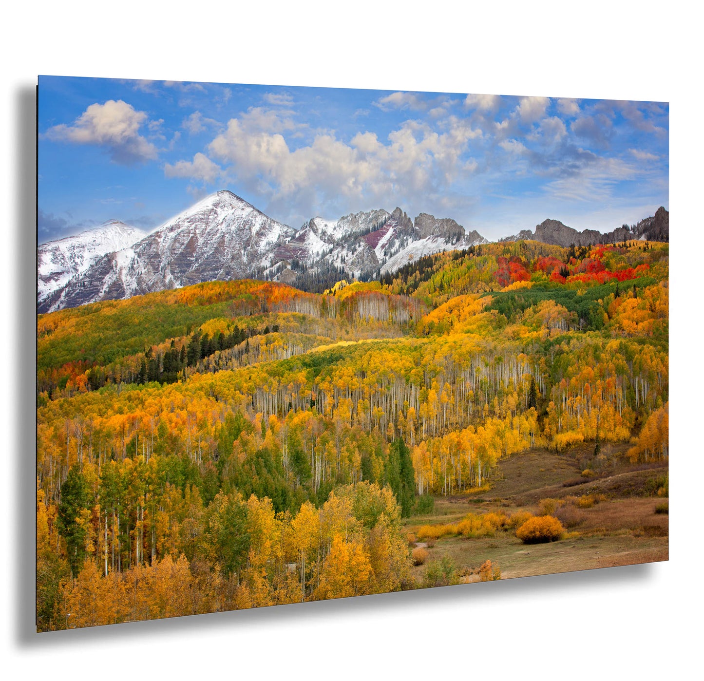 a scenic view of a mountain range in autumn