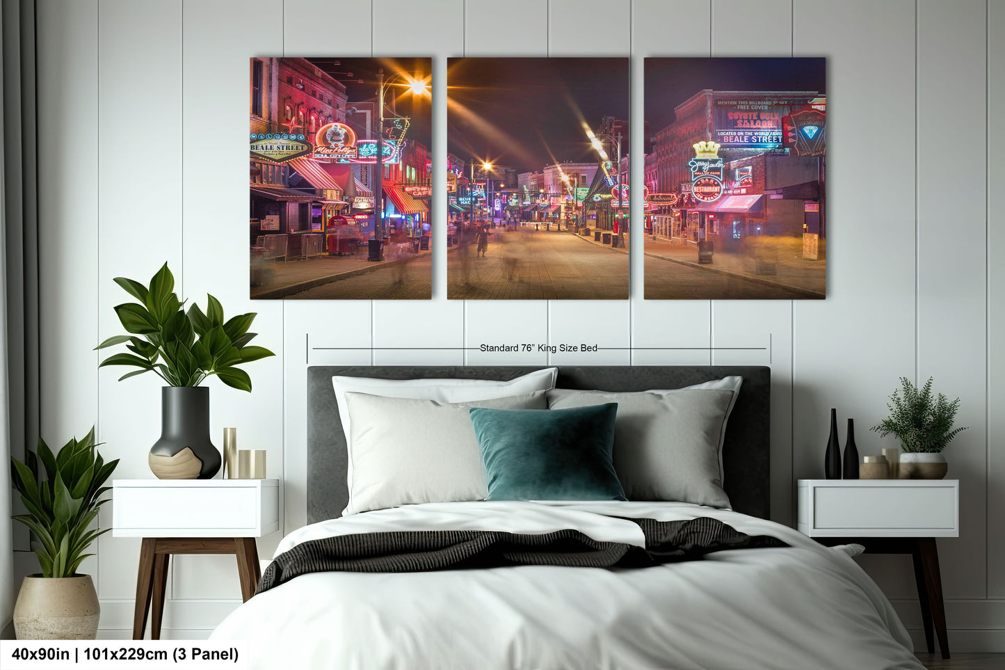 a bed room with a neatly made bed and three pictures on the wall