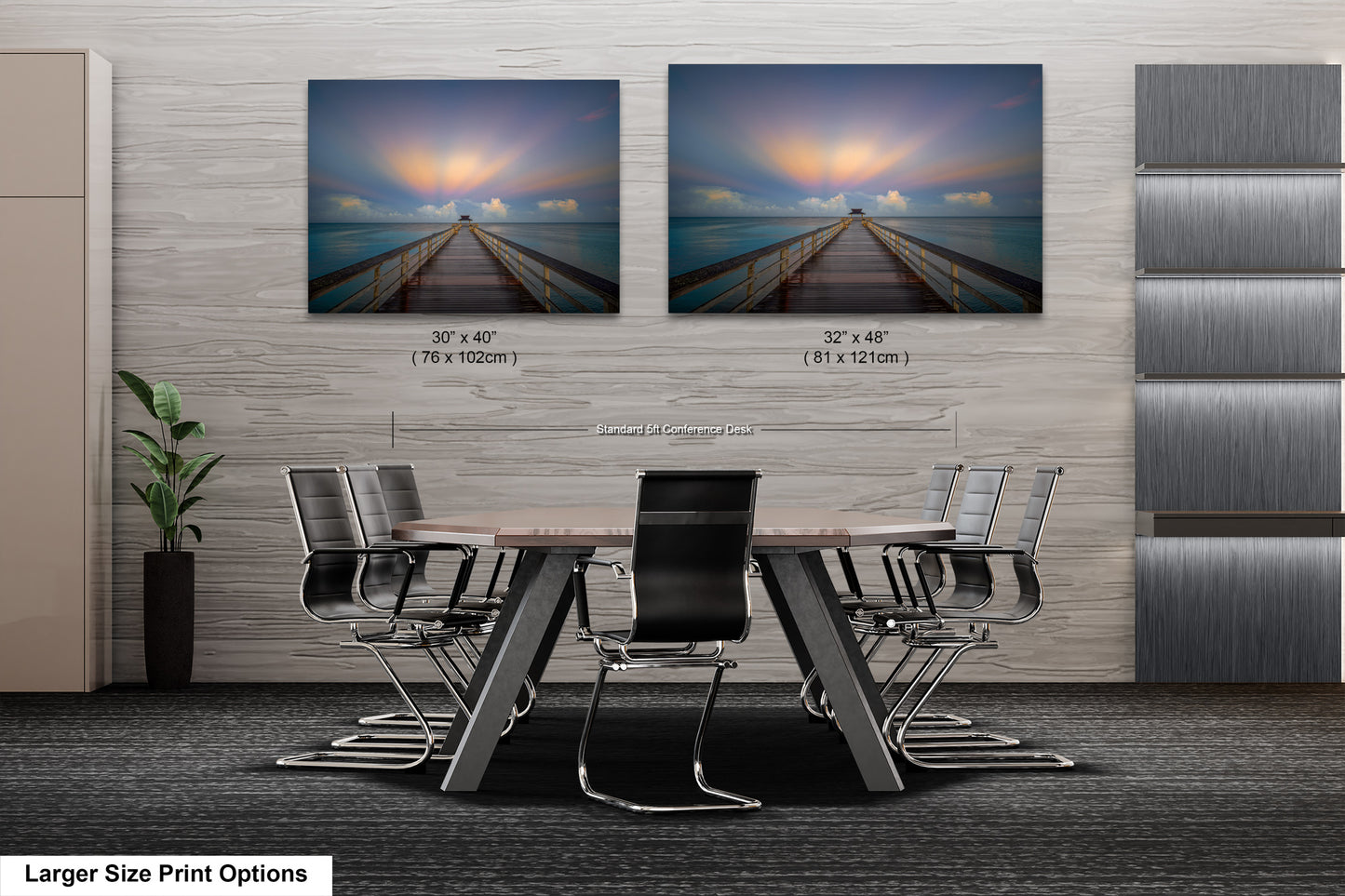 a dining room table with chairs and two pictures on the wall