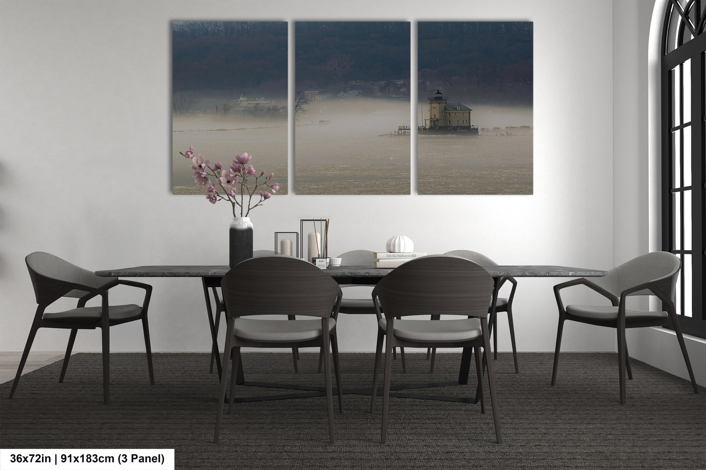 a dining room table with four chairs and a vase of flowers