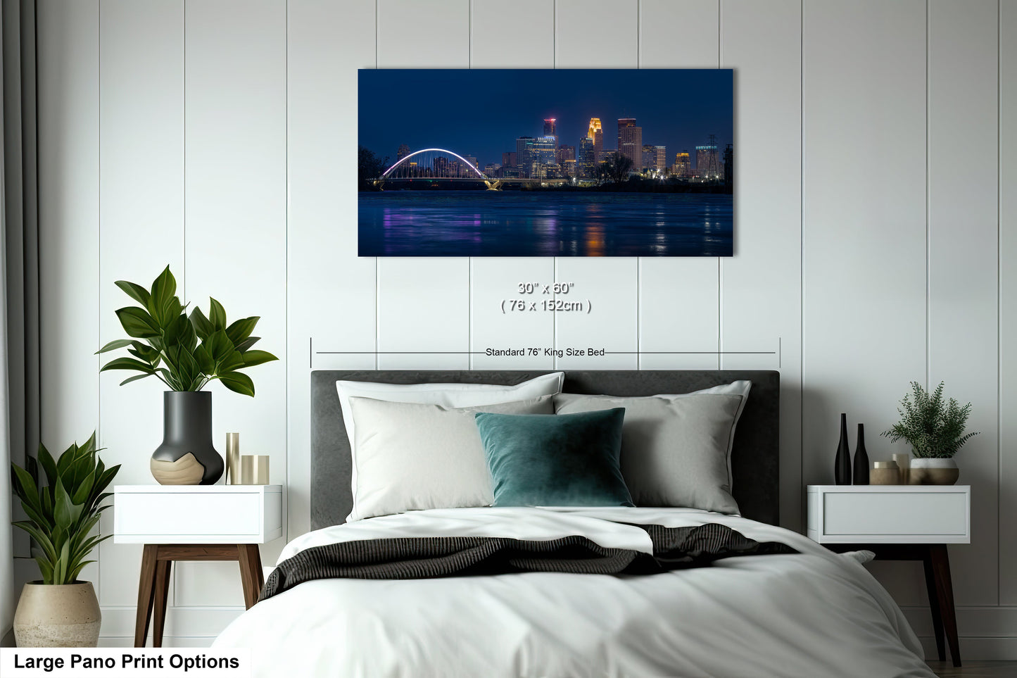 a bedroom with a large bed and a night view of a city