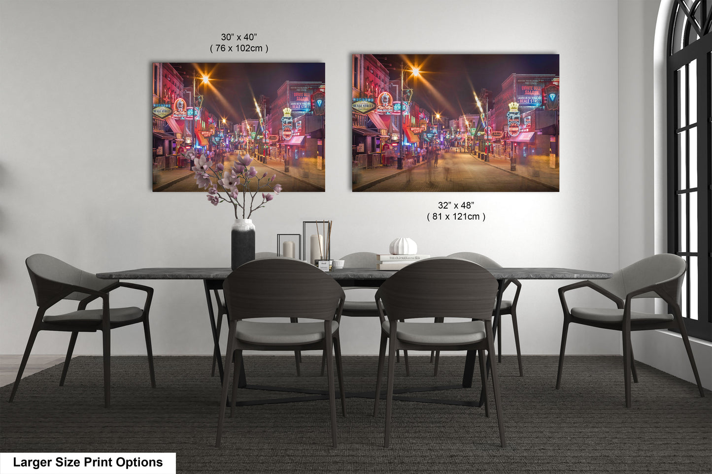 a dining room table with chairs and a vase of flowers