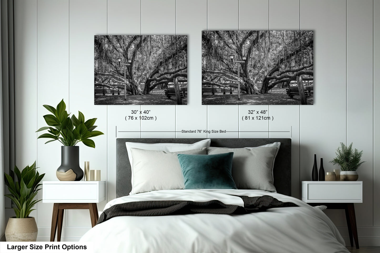 a bed with a white comforter and two black and white pictures on the wall