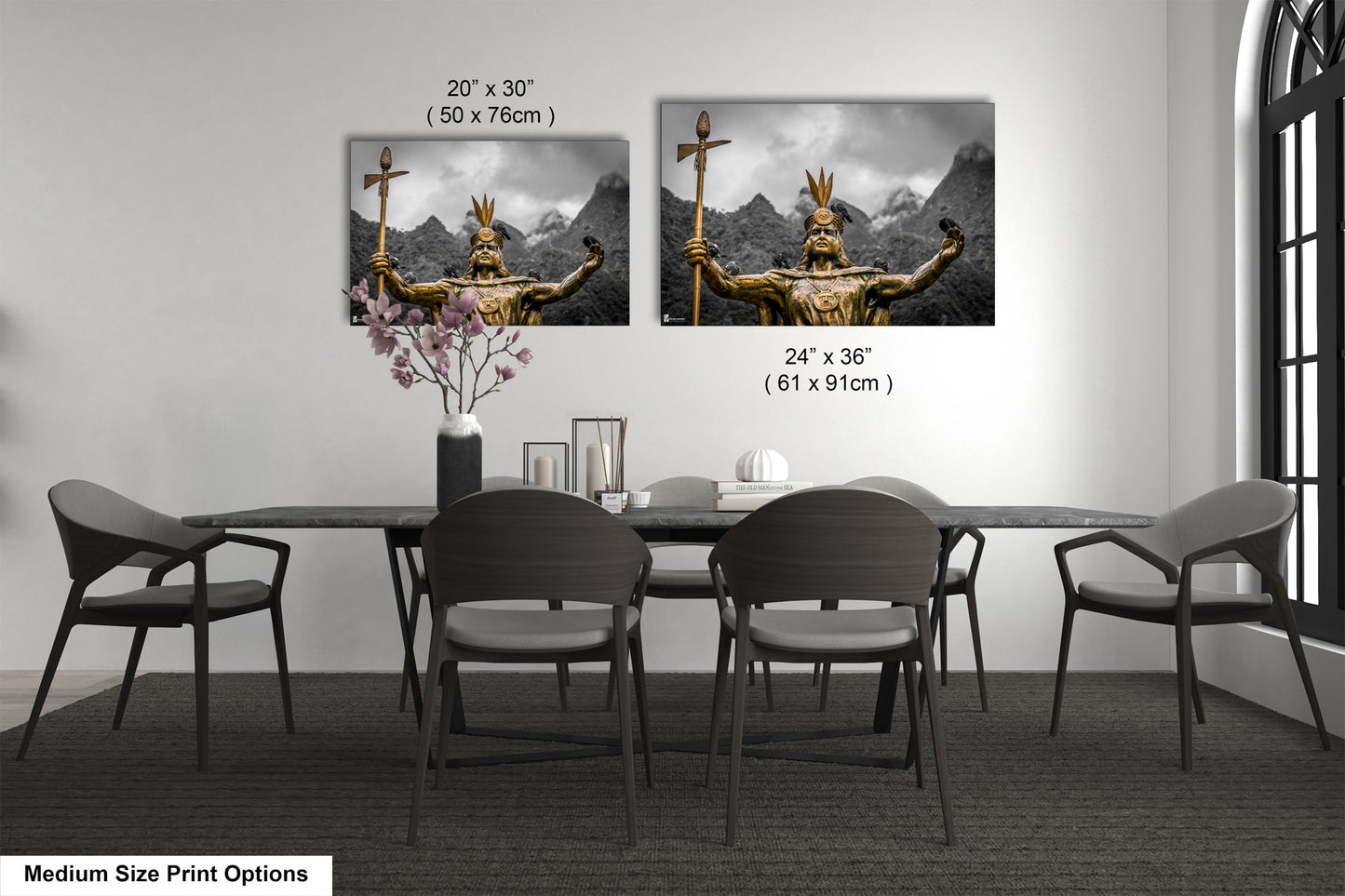a dining room table with four chairs and a vase of flowers