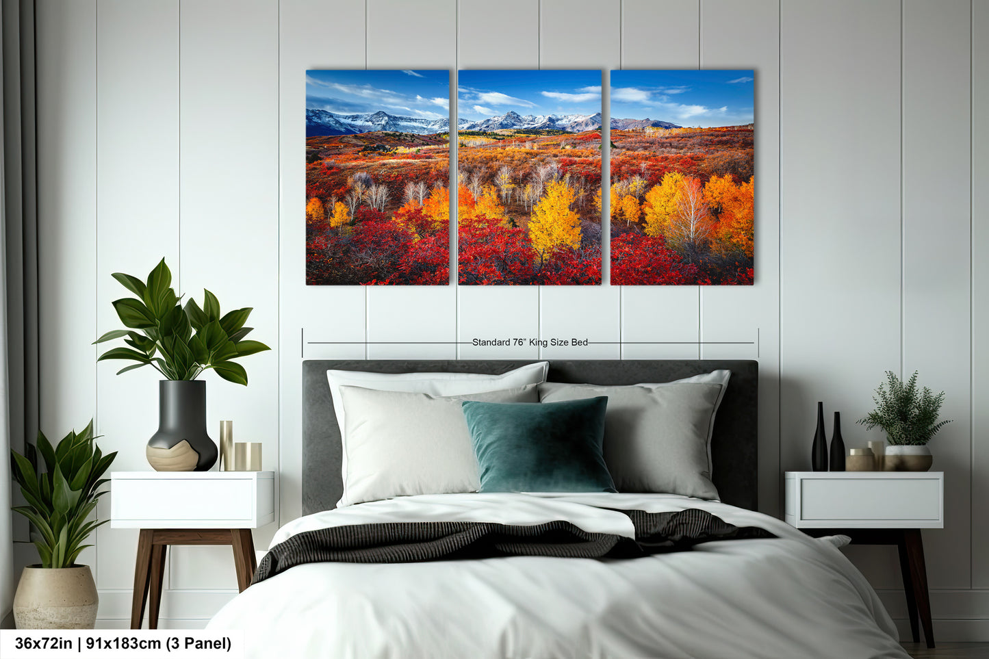 a bedroom with a bed and two paintings on the wall