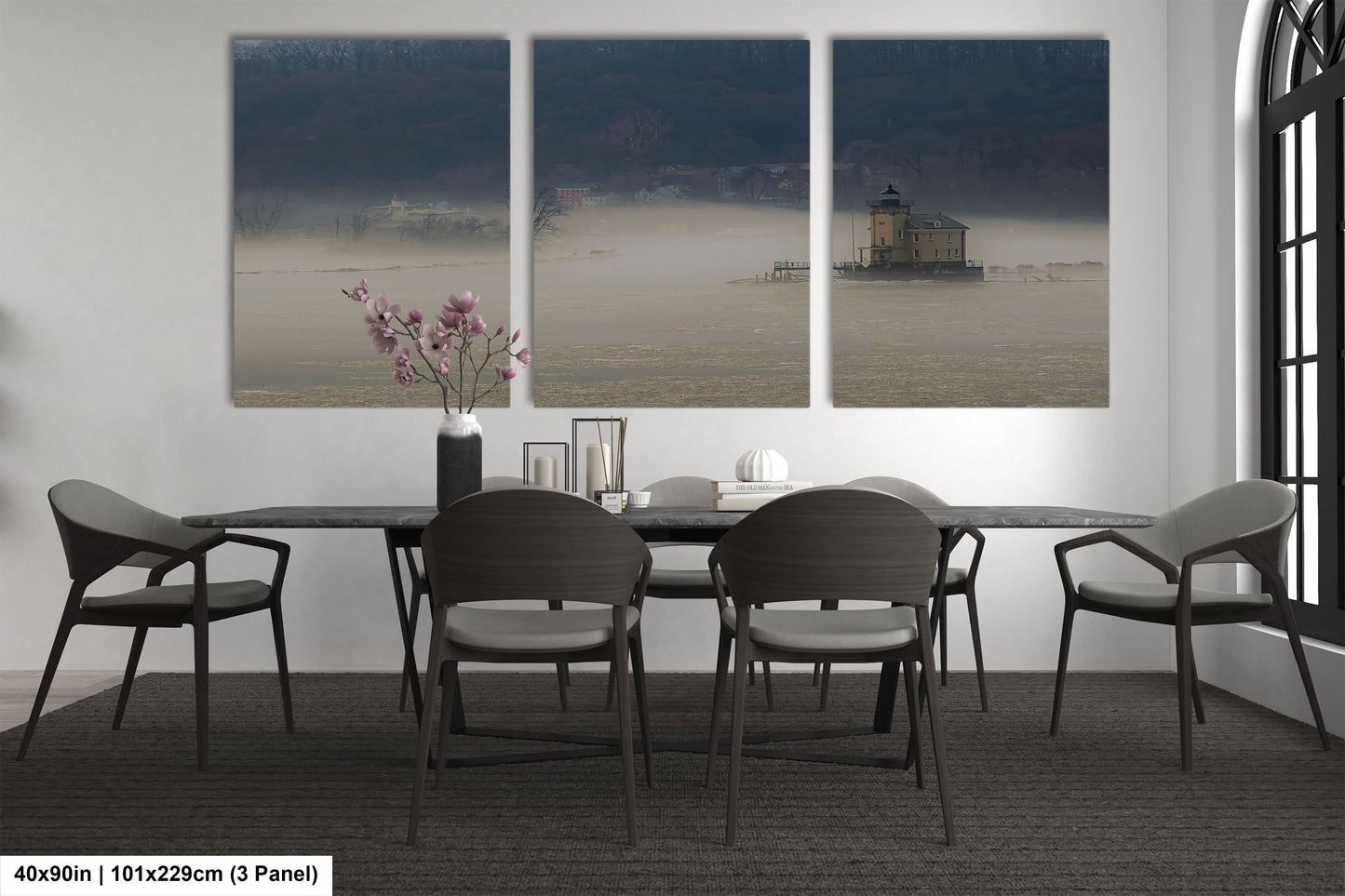 a dining table with four chairs and a vase of flowers