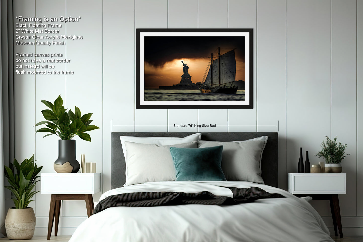 a picture of a bed with a statue of liberty in the background