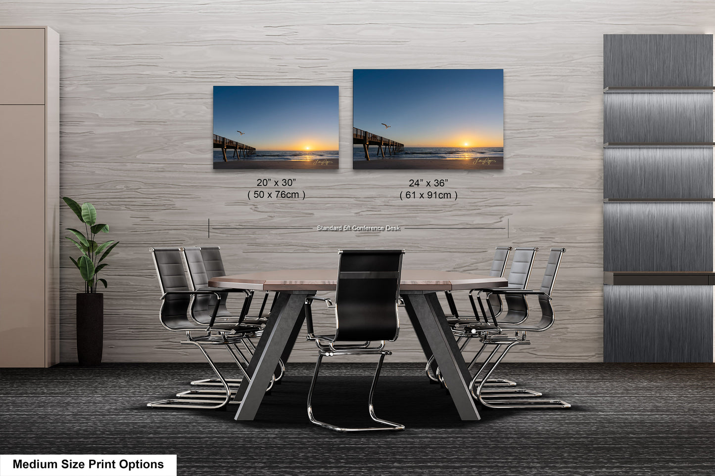 a dining room table with chairs and two pictures on the wall
