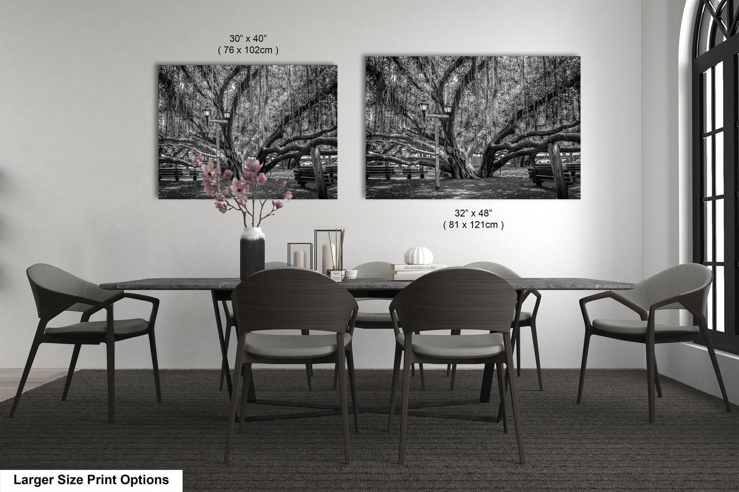 a black and white photo of a dining room table