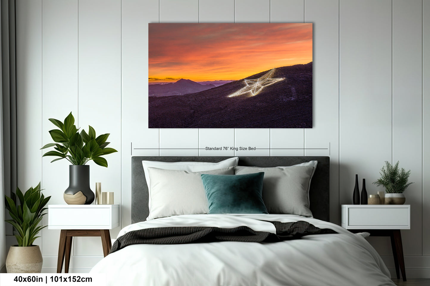 a bedroom with a bed and a painting on the wall