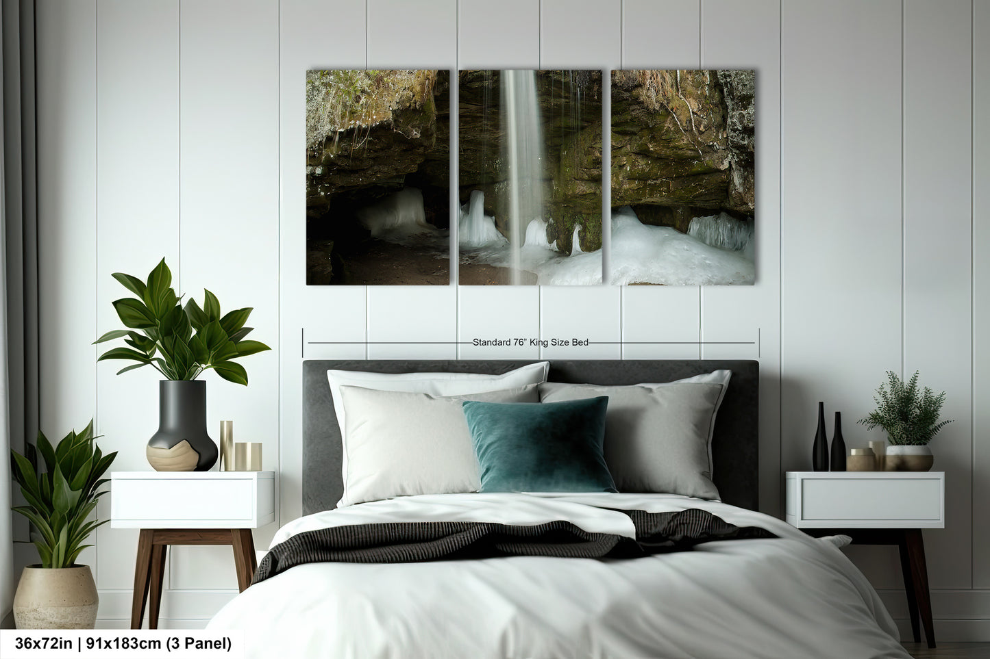 a bed with a white comforter and two paintings on the wall