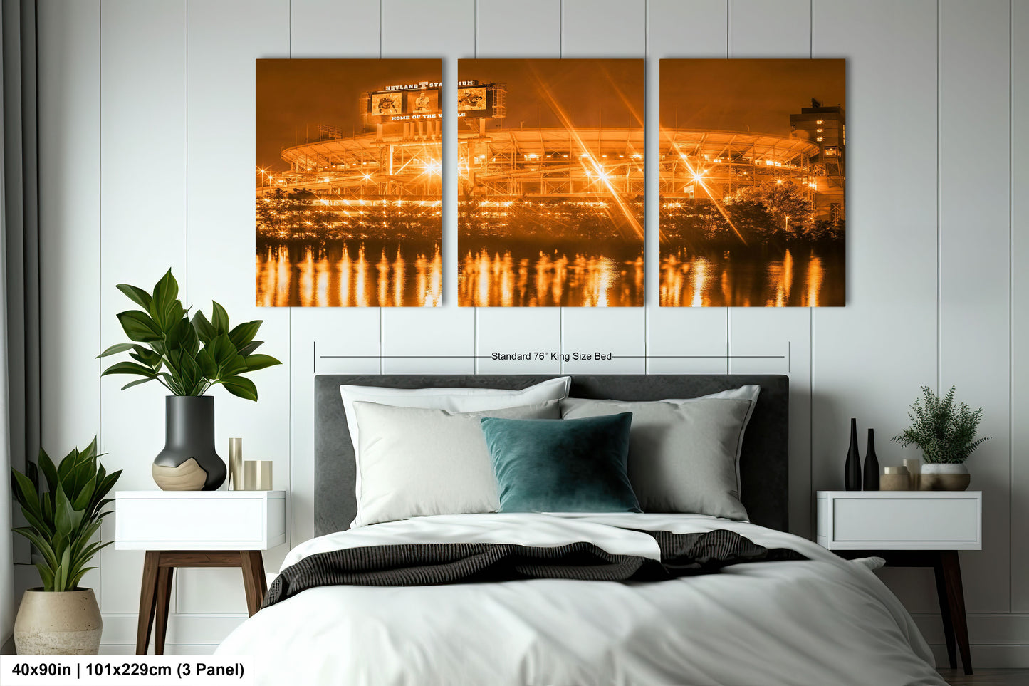 a bed room with a neatly made bed and a painting on the wall